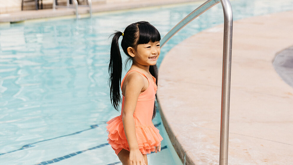 Kid walking into the pool at Summerland Waterfront Resort & Spa