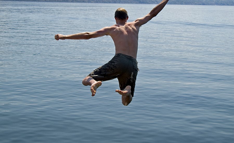 Boy Jumping off Pier high