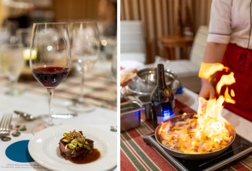 Glass of red wine with a chef-made bite on a festive table, and a chef flambéing in a skillet at a Christmas tasting evening at Summerland Waterfront Resort & Spa