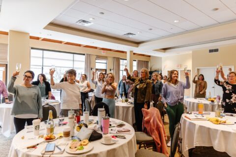 SWR ball room meeting cheers 2 credit stephanie lucile photography min